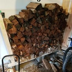 a pile of wood sitting next to a bike