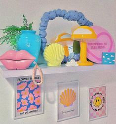 there is a shelf that has various items on it, including shells and other things