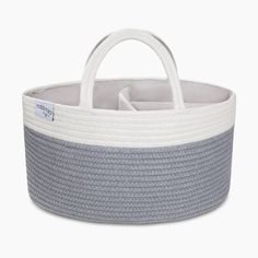 a grey and white basket with handles