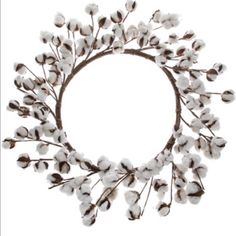 a wreath made out of cotton flowers on a white background