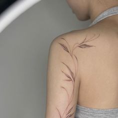 a woman with a tattoo on her arm