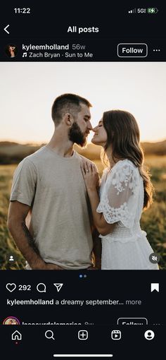 a man and woman standing next to each other in front of a field with grass