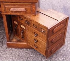 two wooden drawers are open on the floor