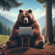 a large bear sitting in front of a laptop computer