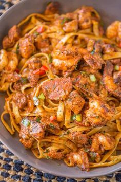 pasta with shrimp and peppers in a bowl