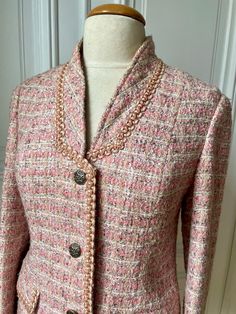 Beautiful French vintage jacket, in a pale pink, very elegant. , made with a woven fabric of pink, beige and grey Hand Made by a French tailor very nice shape, especially with its collars It Sizes for French  medium Size, but please see measures in the listing mannequin is a 38 French size, it fits, with possibility to put a sweater under lighty curved, not too much under the arms, lying flat : 19 waist 18,5  total length 26 on the grey lining, please note a discoloration on armpit, due to deodo Pink Fitted Tweed Jacket For Formal Occasions, Fitted Pink Tweed Jacket For Formal Occasions, Pink Fitted Tweed Jacket For Spring, Spring Pink Fitted Tweed Jacket, Formal Pink Tweed Blazer, Elegant Pink Long Sleeve Tweed Jacket, Elegant Pink Tweed Outerwear, Pink Single-breasted Tweed Jacket, Pink Fitted Tweed Jacket For Work