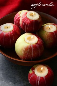 an image of apples with candles in them