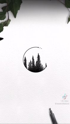 a drawing of trees in the middle of a circle with leaves around it and an ink pen