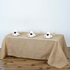 the table is set with three place settings for two people to enjoy each other's company