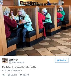 some people sitting at tables in a restaurant