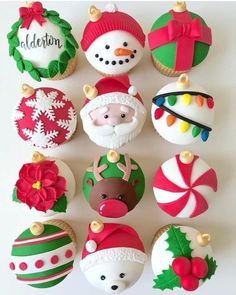 twelve decorated christmas cupcakes arranged in the shape of santa claus