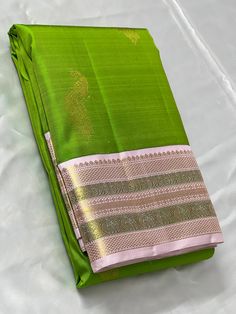 Bridal Collection Parrot Green Color Pure Kanchipuram Silk Saree | Indian Traditional Ethnic Saree | Wedding or Party Wear Saree | Handwoven Gift Saree for Her Product Details : Saree Type : Pure Kanchipuram Silk Saree Golden Zari, Silk Mark Certified Blouse Piece : Yes (Un-Stitched) Saree Length : 5.5 Meters Blouse Piece Length : 80 cm Saree Weight : 0.9 kg Saree Fabric : Pure Kanchipuram Silk  Color : As shown in the picture Work : weaving Pattern : designer Occasion: Party Wear, Formal Wear, Parrot Green Silk Saree, Saree Golden, Ethnic Saree, Stitched Saree, Wedding Lehenga Designs, Traditional Silk Saree, Silk Saree Kanchipuram, Parrot Green, Bead Hair Accessories