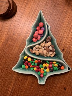 a christmas tree made out of candy sits on a table