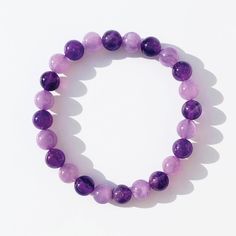 This exquisite amethyst piece is not just a jewelry accessory; it's a symbol of love, inspiration, and empowerment. The vibrant blend of pink and purple hues in the amethyst gemstone radiates positivity, while its delicate design adds a touch of elegance to any outfit. Whether you're spoiling yourself or surprising a loved one, this bracelet is the perfect way to uplift spirits and remind yourself or someone special of the incredible strength and beauty within. Embrace the joy of gifting and spr Purple Crystal Bracelet With 8mm Beads As A Gift, Purple Bracelets With 8mm Beads As Gift, Purple 8mm Beads Bracelets As Gift, Purple Amethyst Bead Jewelry, Purple Amethyst Bracelet For Gift, Pink Amethyst Spiritual Jewelry, Pink Amethyst Bracelets For Healing, Purple Crystal Bracelet With Natural Stones As Gift, Pink Amethyst Healing Bracelet