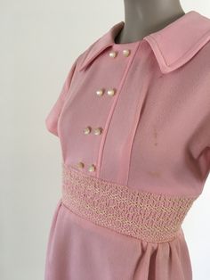 "1970's pink polyester mini dress. Several discolored spots through out the dress (see photos) Size XS in womens Measurements: B: 34\" W: 26\" H: 38\" Shoulder to top of band: 11.5\" Band height: 3\" Bottom of band to hem: Sleeve length: 7.5\"" Fitted Pink Dress With Buttons, Pink Mini Vintage Dress For Spring, Fitted Pink Vintage Dress For Spring, Pink Lined Vintage Dress, Pink Fitted A-line Vintage Dress, Vintage Pink Mini Dress, Vintage Lined Pink Dress, Fitted Vintage Mini Dress With Buttons, Pink Vintage Lined Dress