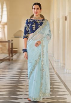 Sky blue organza party wear saree 7602  Desc:  Color : Sky Blue Fabric : Organza Work : Embroidery Wash Care : Dry clean Sleeve Style : Quarter Sleeve Long Sleeves : Done only in Custom Stitch Sleeves Lining : Done only in Custom Stitch Bust Size : 32 to 42 Inches Occasion : Festival   Christmas   Diwali   Mehendi   Sangeet   Party Wear   Engagement   Reception   Gudi Padwa. With Express Free Shipping and Custom Stitching, Buy Indian Wedding Party Wear Saree Sky blue organza party wear saree 760 Organza Fashion, Sky Blue Saree, Blue Organza, Wedding Saree Blouse, Organza Silk Saree, Organza Blouse, Organza Wedding, Elegant Attire, Blue Saree