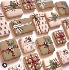 many decorated cookies with bows and presents on them are arranged in the shape of squares