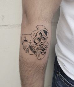 a man's arm with a tattoo on it that has an image of a person holding