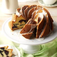 a bundt cake with slices cut out on a plate