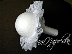 a close up of a white object with lace on it's headbands