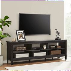 an entertainment center with a flat screen tv mounted on the wall