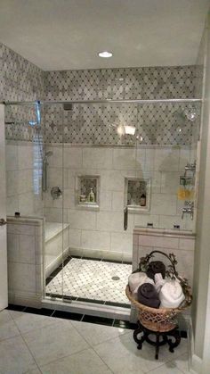 a bathroom with a walk in shower next to a white sink and bathtub area