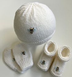 Hand-knitted in soft pure Australian merino wool (easy care), these baby items will make a timeless and practical newborn baby or shower gift. Choose from booties, hat or mittens, or a matching set, which fit average newborn size (head circumference up to 40cm and foot length up to 9cm).  Note that hat brim can be turned up to fit smaller babies and then down as baby grows (see photos). These sets are personally hand knitted by me, and available in winter white merino wool (note that colour may vary very slightly with wool dye lots and the display on your device) and I also do the hand-embroidery with quality DMC threads. Easy care - wash on gentle cycle in lingerie bag. Also available in navy, denim blue and baby blue (see separate listings). Hand-crafted by me in my smoke-free and pet-fr Newborn Hats, Shower Bebe, Small Baby, Baby Grows, Head Circumference, Gender Neutral Baby, Winter White, Baby Clothing, Baby Items