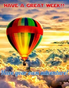 a hot air balloon flying above the clouds