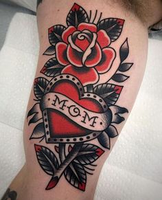 a tattoo with a heart and roses on it