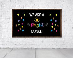 we are a bright punch sign in front of a white brick wall with colorful confetti