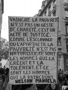 black and white photograph of protest sign in french