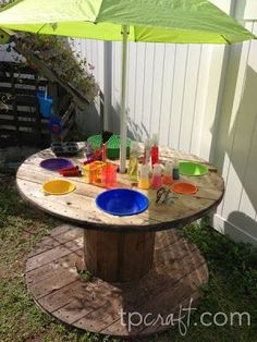 an image of a table made out of wood and plastic bottles on top of it