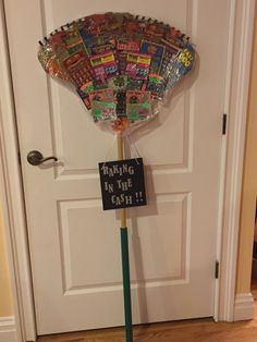 a hand fan that has been placed in front of a door with a sign reading baking in the oven