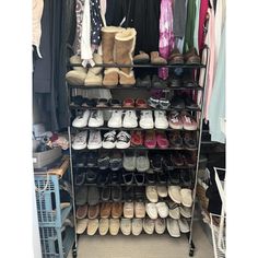 an organized closet with shoes and other items