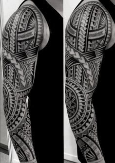 a man's leg with an intricate tattoo design on the arm and shoulder, in black