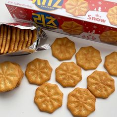 some cookies are next to a box of crackers