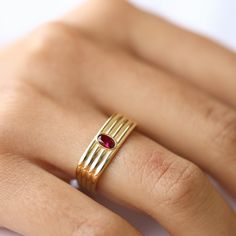 Discover the elegance of our 14k gold ring, beautifully adorned with sparkling zircon stones. This delicate, handcrafted ring is perfect for women who appreciate minimalist jewelry with a touch of luxury. Whether you prefer rose gold, yellow gold, or white gold, this stackable ring fits seamlessly into any collection. Ideal as an anniversary gift, birthday gift, or a thoughtful Mother's Day gift, it's a versatile piece that can be worn every day. Crafted with care, this dainty ring embodies the Formal Gold Stackable Ruby Rings, Luxury Gold Ruby Stackable Ring, Gold Plated Birthstone Ring For Promise, Gold Plated Diamond Ring With Polished Finish As Gift, Modern Ruby Birthstone Ring For Anniversary, Heirloom Gold Plated Rings For Anniversary, Gold Plated Birthstone Rings As Gift, Yellow Gold Dome Ring With Gemstone For Gift, Gold Plated Birthstone Rings For Wedding