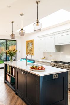 a large kitchen with an island in the middle