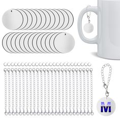 a white coffee mug with chain and keychains next to it on a white background