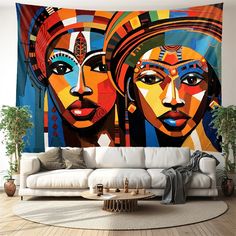 a living room with a couch and large painting on the wall above it's head