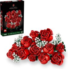 a bunch of red roses sitting next to a box