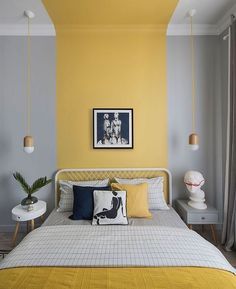 a bedroom with yellow and gray walls