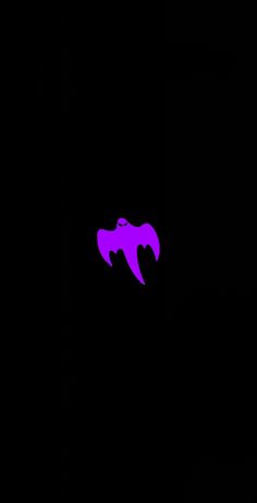 a black and purple wallpaper with the shape of a bat on it's side