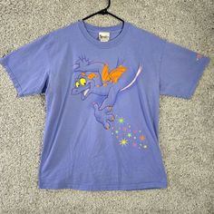 Vintage Walt Disney World Figment Shirt Adult Large Purple Double Sided Dragon 90s Good Pre-Owned Condition (See Photos For Details) * Style Profile: Casual, Everyday, Dragon, Double Sided * Size: Large * Flaws: Has A Tiny Spot On The Back * Chest Flat: 21 * Length: 27 * Happy To Answer Your Questions * Items Are Carefully Examined, Measured, Photographed And Stored In A Smoke Free Environment / Figment Shirt, 90s Colors, Disney Shirts, Casual Everyday, Style Profile, Walt Disney World, Walt Disney, Disney World, Double Sided