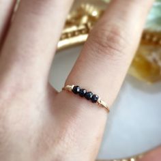 Raw Black Tourmaline Bar Ring ✨Handmade with 14K Gold Filled, Rose Gold Filled, Sterling Silver, Dainty Gemstone Ring🖤 Simple design stacking ring with genuine black tourmaline. Very dainty and cute ring for everyday wear.• Gemstone Size: 4 mm• Ring Band: 0.8 mm🖤 Black tourmaline is a protective stone that helps to remove negative energies within a person or space. It will cleanse, purify, and transform dense energy into a lighter vibration. Perfect for empath protection. 🖤• Handmade in your Dainty Black Adjustable Rings, Black Tourmaline Jewelry Gift, Black Tourmaline Ring, Black Tourmaline Stone, Raw Black Tourmaline, Bar Ring, Tourmaline Ring, Cute Rings, Black Tourmaline