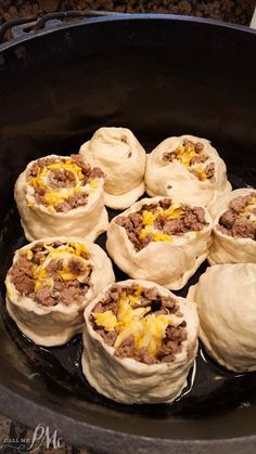 some food is being cooked in a pan on the stove and ready to be eaten