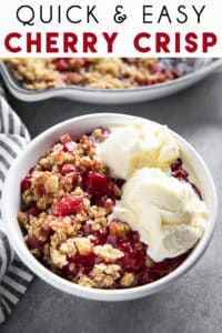 a bowl filled with ice cream and crumbled strawberries next to another bowl