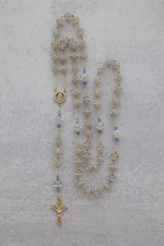 Something Blue Wedding Rosary | 14K Gold Filled with Crystal Beads | Catholic Wedding Gift Add a touch of elegance and tradition to your special day with this stunning Something Blue Wedding Rosary. Crafted with 14K gold-filled details and sparkling crystal beads, this rosary makes a beautiful and meaningful gift for the bride. A perfect keepsake for a Catholic wedding, it features an intricately detailed Virgin Mary centerpiece, symbolizing love, faith, and devotion. Whether for prayer or as a Vintage Catholic Jewelry, Blue Catholic Aesthetic, Elegant Beaded Wedding Rosary, Elegant Pearl White Rosary For Wedding, Catholic Wedding Aesthetic, Rosary Aesthetic, Rosary Ideas, Catholic Wedding Gifts, Diy Rosary