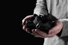 Man with handful of coal on dark background, closeup. Space for text royalty free stock photos Space Text, Dark Background, Dark Backgrounds, Free Stock Photos, Close Up, Photo Image, Royalty, Royalty Free