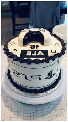 a white and black cake sitting on top of a table